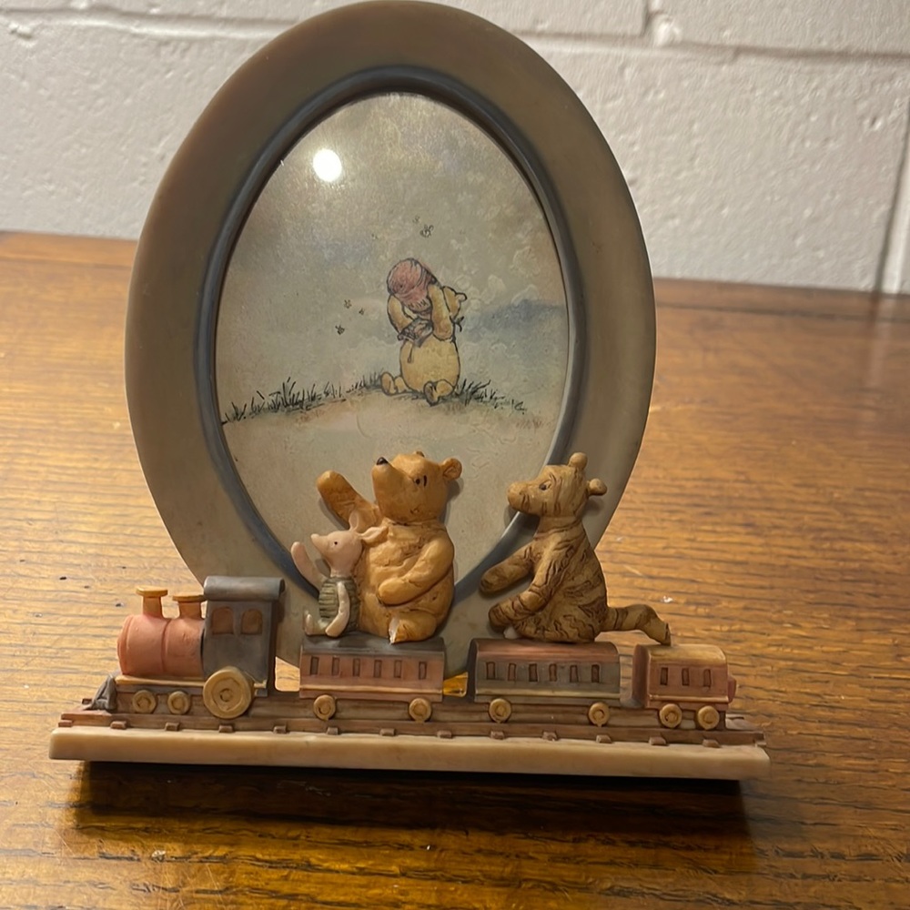 Disney Charpente Vintage Winnie the Pooh oval picture frame with a train.